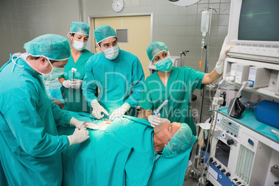 Surgeon looking at a monitor while operating
