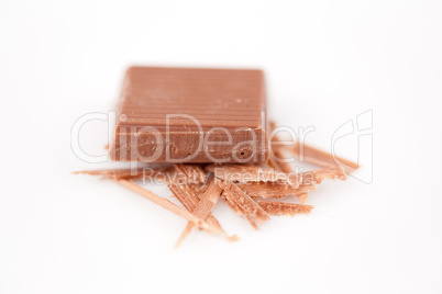 Piece of chocolate on chocolate shavings