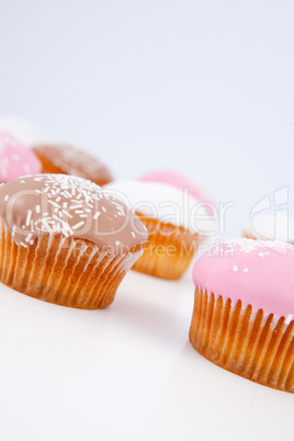 Muffins with icing sugar lined up