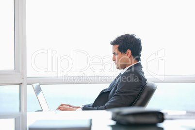 Man typing on a computer