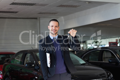 Salesman holding car keys