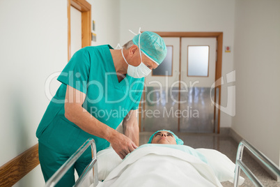 Surgeon next to a patient