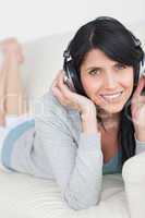 Woman smiling and wearing headphones