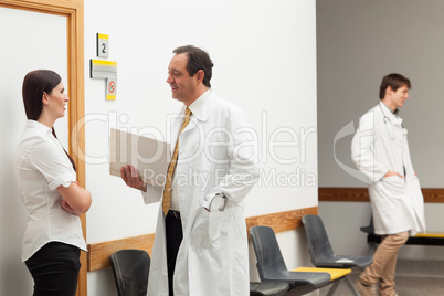 Doctors and a patient talking