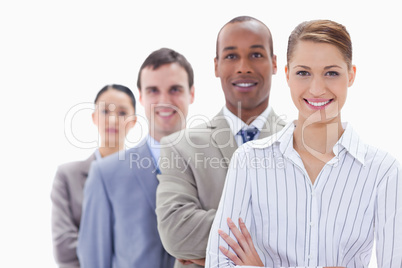 Close-up of a business team smiling in a single line