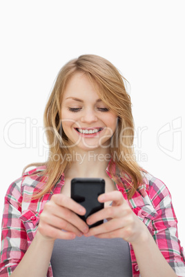 Smiling woman using a mobile phone