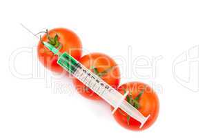 Syringe on tomatoes