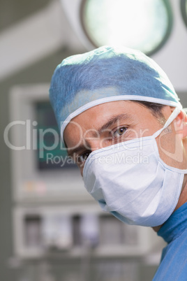 Serious doctor looking at camera