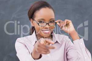 Teacher touching her glasses