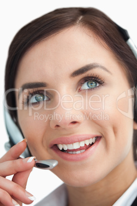 Blue eyed businesswoman with headset looking up