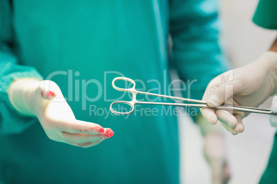 Close up of a nurse giving a surgical compress