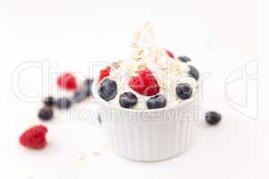 Jar  of whipped cream and berries