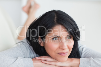 Smiling woman laying on a couch