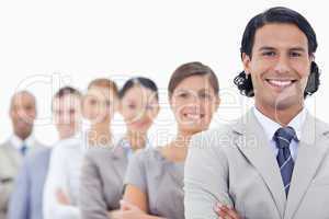 Big close-up of a happy business team in a single line looking s