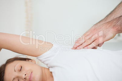Peaceful patient being massaged by a doctor