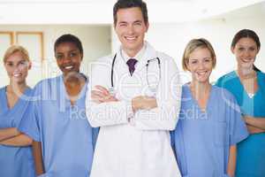 Nurses surrounding a doctor