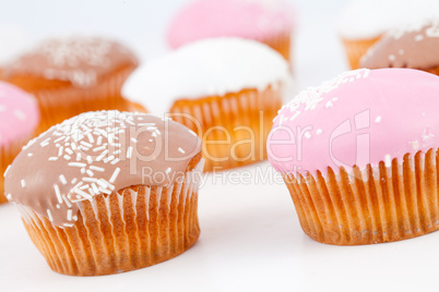 Muffins with icing sugar placed together
