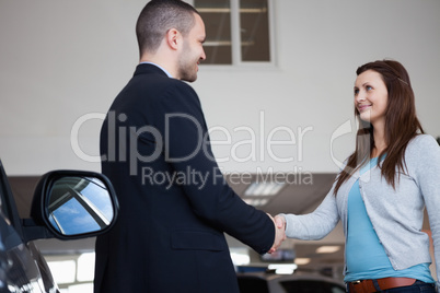 Salesman shaking hand of a client