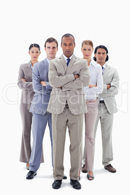 Determined business team crossing their arms