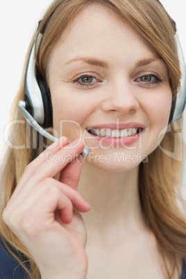 Woman with headset looking at camera