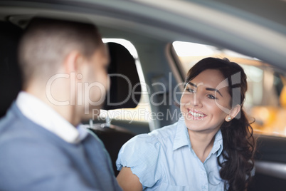 Couple smiling in a car