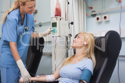 Nurse checking the pulse of a patient