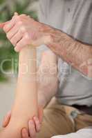 Ankle and elbow of a patient being manipulated