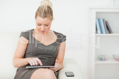 Woman touching the screen of an ebook