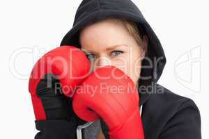 Woman with hoodie boxing