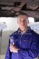 Mechanic holding an adjustable pliers