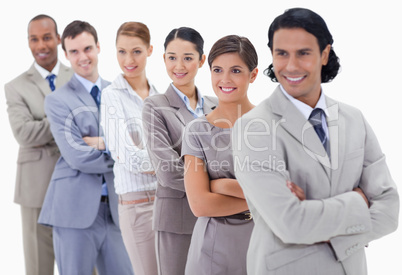 Big close-up of a business team in a single line looking towards