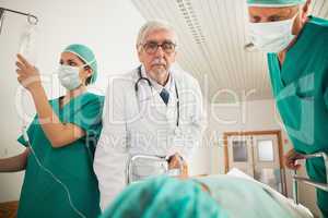 Doctor and surgeon looking at a patient