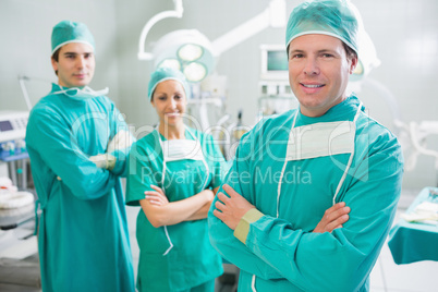 Surgical team smiling with arms crossed