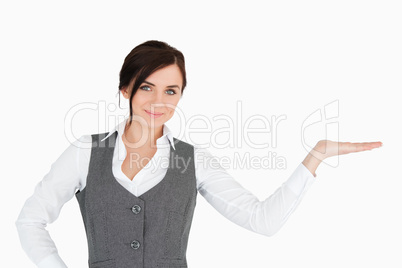 Beautiful businesswoman with her palm facing up