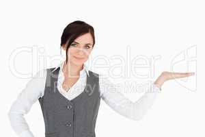 Beautiful businesswoman with her palm facing up