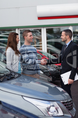 Businessman shaking hand  of a man