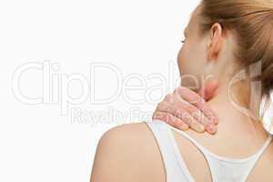 Woman massaging her painful neck