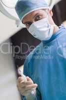 Doctor holding a medical tool