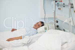 Male patient lying on a medical bed