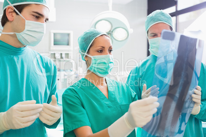 Surgical team looking at a X-ray