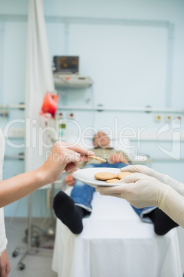 Patient taking a biscuit