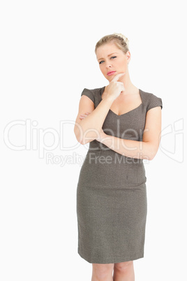 Thoughtful woman standing