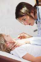 Serious doctor examining a child