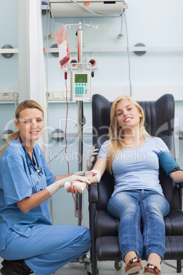 Female patient and nurse looking at camera