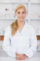 Blonde pharmacist smiling