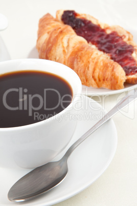 Coffee cup with croissant