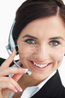Smiling green eyed businesswoman with headset