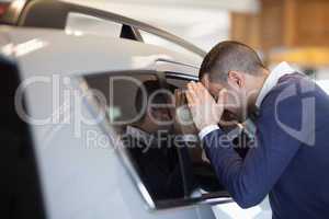 Client looking inside a car