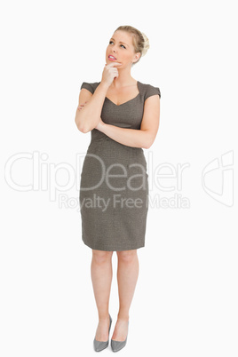 Woman standing while looking up something