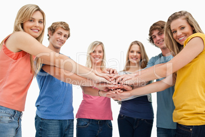 Low angle shot of friends smiling and looking at the camera